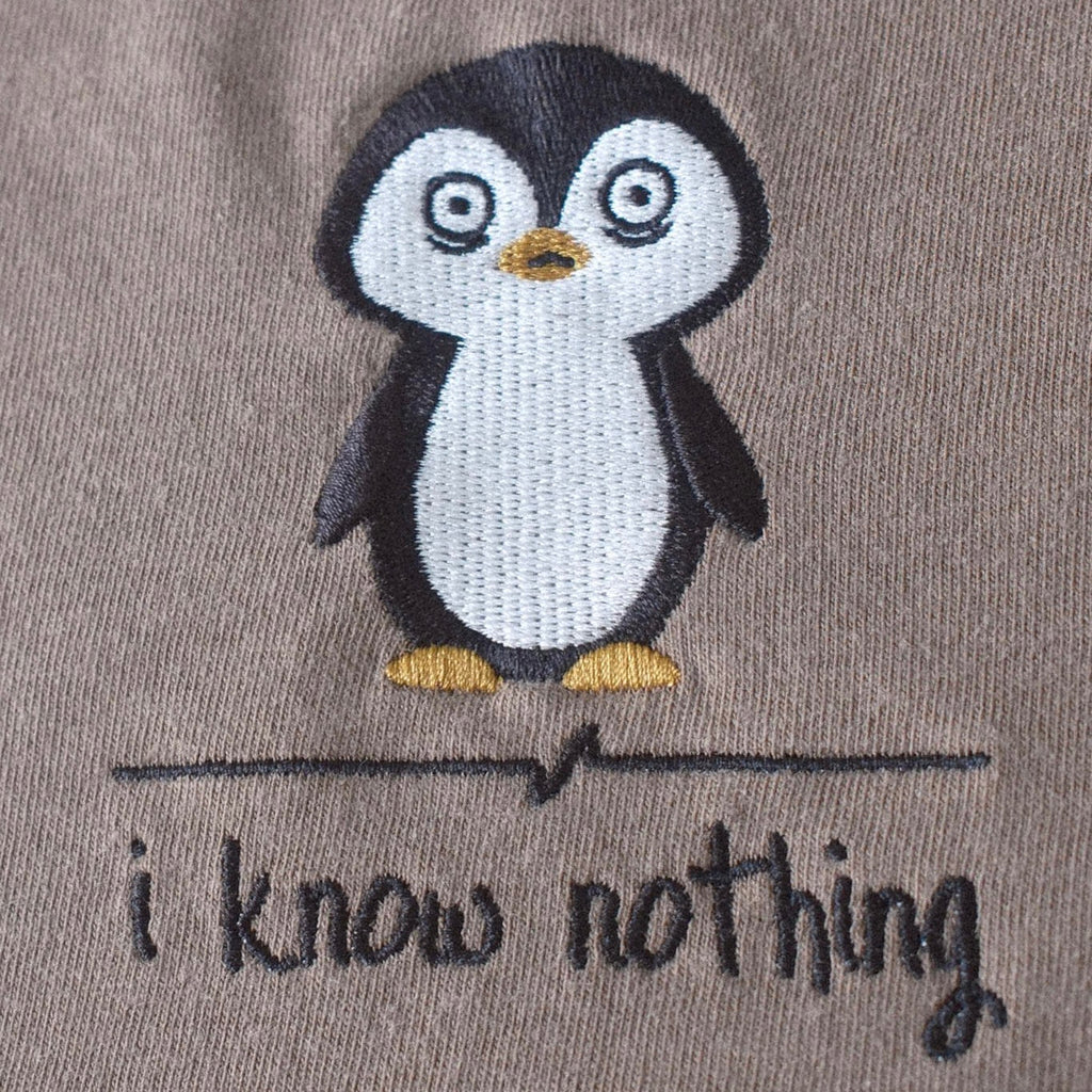 Embroidered penguin detail close-up