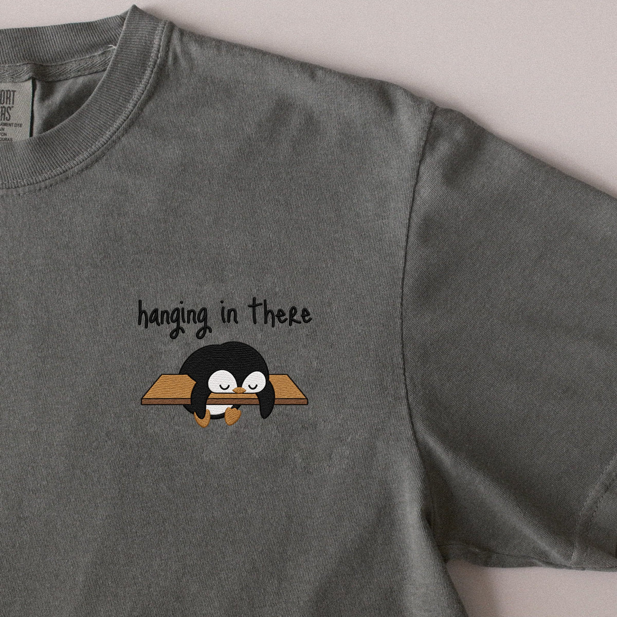 Hanging in There embroidered t-shirt in Moss